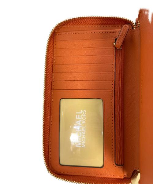 MICHAEL KORS（マイケルコース）MICHAEL KORS (マイケルコース) 長財布 オレンジの古着・服飾アイテム