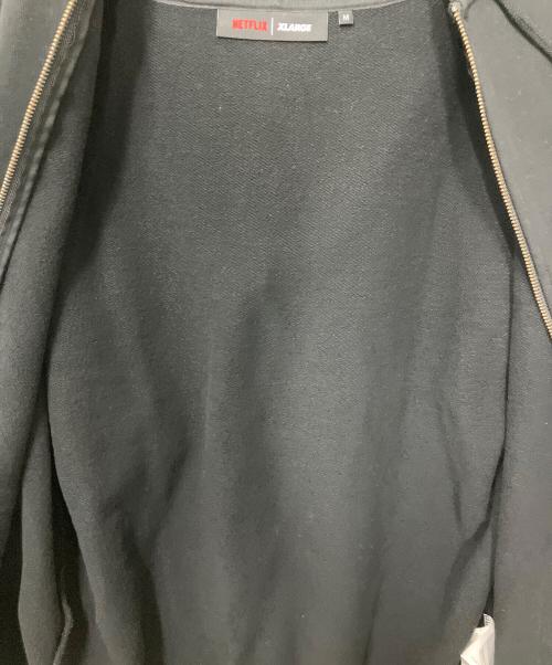 X-LARGE（エクストララージ）X-LARGE (エクストララージ) NETFLIX (ネットフリックス) ジップパーカー ブラック サイズ:Mの古着・服飾アイテム