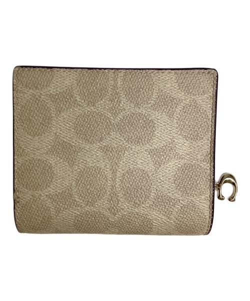 COACH（コーチ）COACH (コーチ) 2つ折り財布 ベージュの古着・服飾アイテム