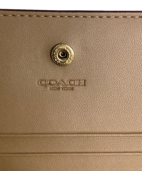 COACH（コーチ）COACH (コーチ) 2つ折り財布 ベージュの古着・服飾アイテム