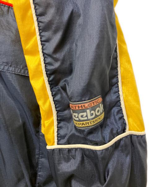 REEBOK（リーボック）REEBOK (リーボック) アノラックパーカー ネイビー×イエロー サイズ:Mの古着・服飾アイテム