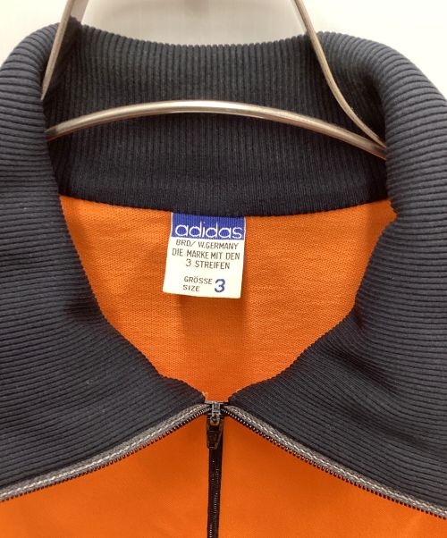 adidas（アディダス）adidas (アディダス) トラックジャケット オレンジ×ブラック サイズ:3の古着・服飾アイテム