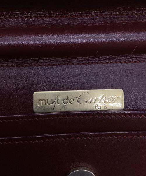 must de cartier（マストドゥカルティエ）must de cartier (マストドゥカルティエ) クラッチバッグ エンジの古着・服飾アイテム