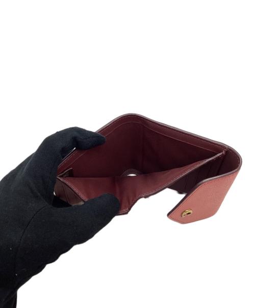 COACH（コーチ）COACH (コーチ) 3つ折り財布 ピンクの古着・服飾アイテム