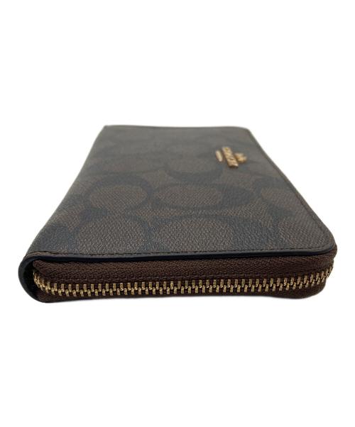 COACH（コーチ）COACH (コーチ) ラウンドファスナー財布 ブラウン×ブラックの古着・服飾アイテム