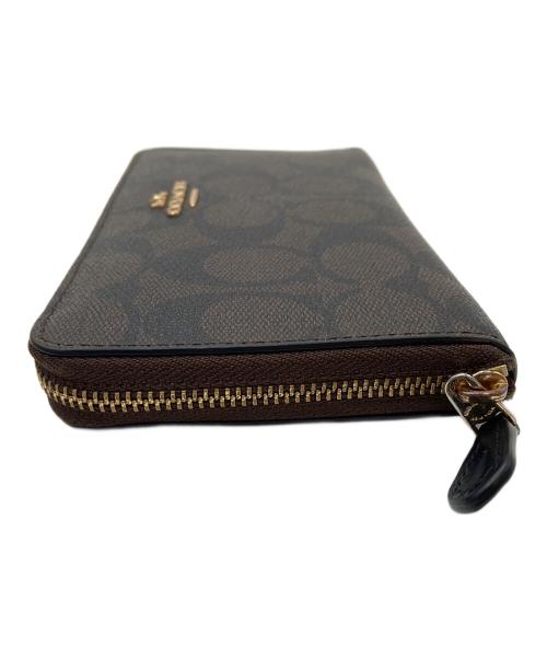 COACH（コーチ）COACH (コーチ) ラウンドファスナー財布 ブラウン×ブラックの古着・服飾アイテム