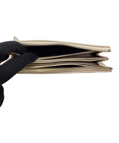 Carving Tribes（カービングトライブス）Carving Tribes (カービングトライブス) 長財布 アイボリーの古着・服飾アイテム