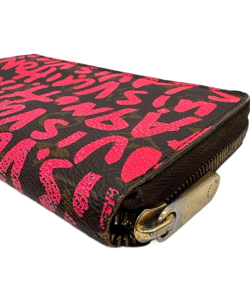 LOUIS VUITTON（ルイ ヴィトン）LOUIS VUITTON (ルイ ヴィトン) ラウンドファスナー財布/モノグラム・グラフティ・ジッピー ウォレット ショッキングピンク・ブラウンの古着・服飾アイテム