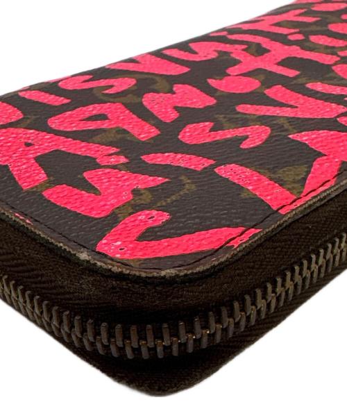 LOUIS VUITTON（ルイ ヴィトン）LOUIS VUITTON (ルイ ヴィトン) ラウンドファスナー財布/モノグラム・グラフティ・ジッピー ウォレット ショッキングピンク・ブラウンの古着・服飾アイテム