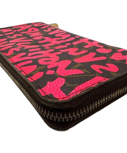 LOUIS VUITTON（ルイ ヴィトン）LOUIS VUITTON (ルイ ヴィトン) ラウンドファスナー財布/モノグラム・グラフティ・ジッピー ウォレット ショッキングピンク・ブラウンの古着・服飾アイテム