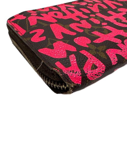 LOUIS VUITTON（ルイ ヴィトン）LOUIS VUITTON (ルイ ヴィトン) ラウンドファスナー財布/モノグラム・グラフティ・ジッピー ウォレット ショッキングピンク・ブラウンの古着・服飾アイテム