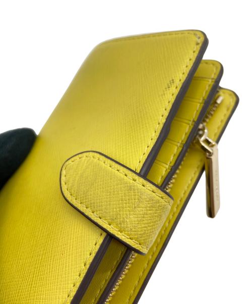 Kate Spade（ケイトスペード）Kate Spade (ケイトスペード) 2つ折り財布 イエローの古着・服飾アイテム