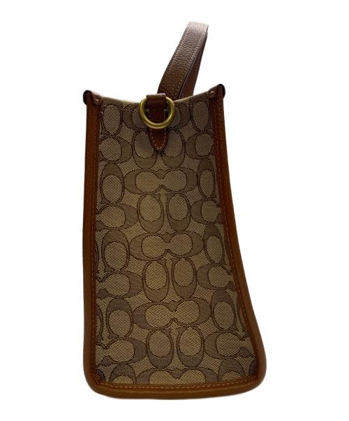 COACH（コーチ）COACH (コーチ) DISNEY (ディズニー) COACH×Disney　シグネチャー　デンプシーキャリーオール　2WAYバッグ ベージュ×ブラウンの古着・服飾アイテム