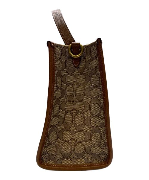 COACH（コーチ）COACH (コーチ) DISNEY (ディズニー) COACH×Disney　シグネチャー　デンプシーキャリーオール　2WAYバッグ ベージュ×ブラウンの古着・服飾アイテム