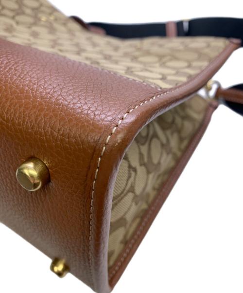 COACH（コーチ）COACH (コーチ) DISNEY (ディズニー) COACH×Disney　シグネチャー　デンプシーキャリーオール　2WAYバッグ ベージュ×ブラウンの古着・服飾アイテム