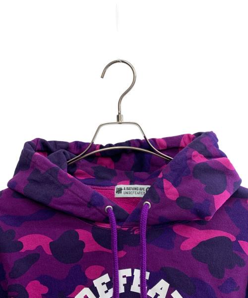 A BATHING APE（アベイシングエイプ）A BATHING APE (アベイシングエイプ) UNDEFEATED (アンディフィーテッド) A BATHING APE×UNDEFEATED　パーカー パープル サイズ:XLの古着・服飾アイテム