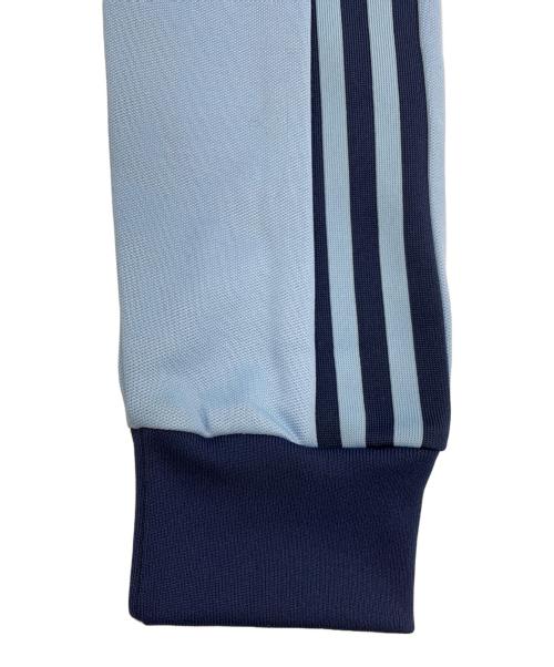 adidas（アディダス）adidas (アディダス) トラックジャケット スカイブルー×ネイビー サイズ:M 未使用品の古着・服飾アイテム
