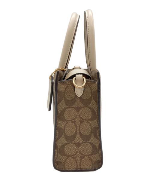 COACH（コーチ）COACH (コーチ) ミニ キャリー クロスボディ シグネチャー キャンバス ブラウンの古着・服飾アイテム