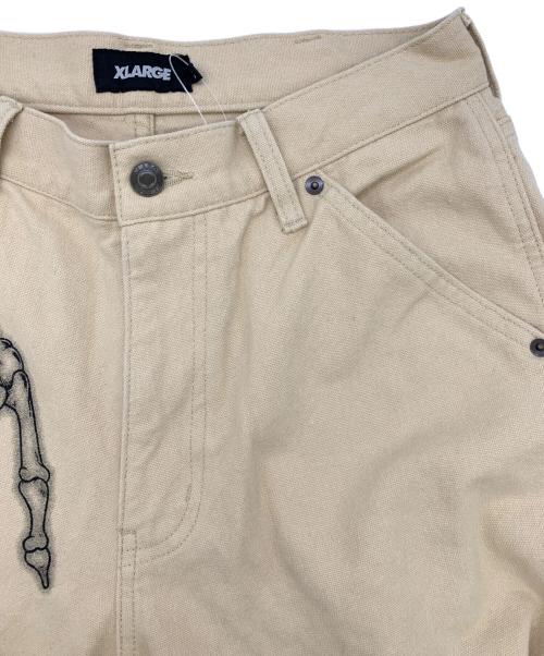 X-LARGE（エクストララージ）X-LARGE (エクストララージ) グラフィックペインターパンツ ベージュ サイズ:30の古着・服飾アイテム