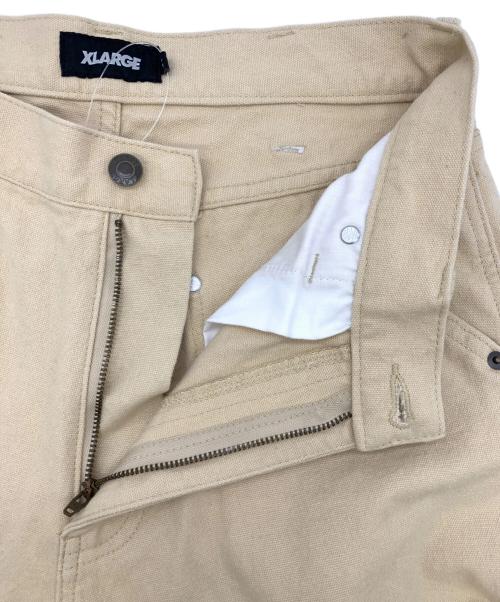 X-LARGE（エクストララージ）X-LARGE (エクストララージ) グラフィックペインターパンツ ベージュ サイズ:30の古着・服飾アイテム