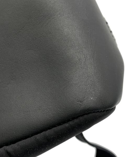COACH（コーチ）COACH (コーチ) DISNEY (ディズニー) チャーリー ミッキー パッチワーク スタッズ ブラックの古着・服飾アイテム