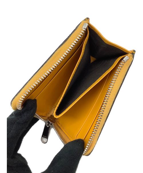 GUCCI（グッチ）GUCCI (グッチ) エンボスレザー グッチシマ コインケース イエローの古着・服飾アイテム