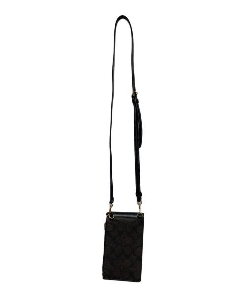 COACH（コーチ）COACH (コーチ) ノース／サウス フォーン クロスボディ・シグネチャー キャンバス ダークブラウン 未使用品の古着・服飾アイテム