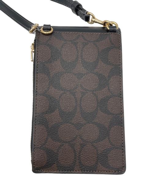 COACH（コーチ）COACH (コーチ) ノース／サウス フォーン クロスボディ・シグネチャー キャンバス ダークブラウン 未使用品の古着・服飾アイテム