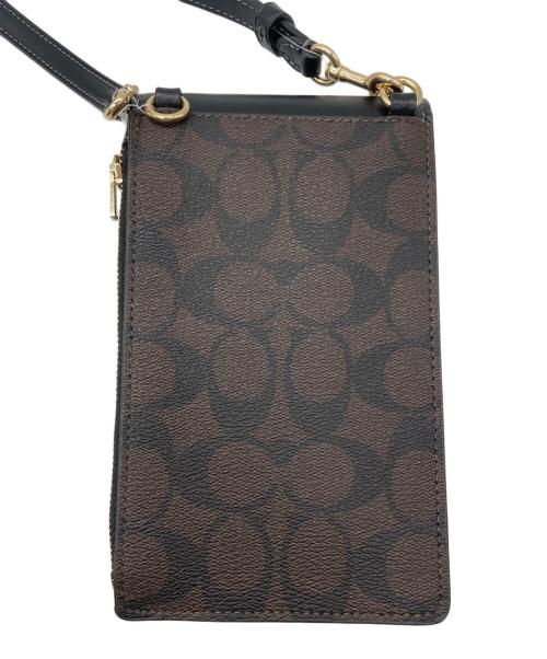 COACH（コーチ）COACH (コーチ) ノース／サウス フォーン クロスボディ・シグネチャー キャンバス ダークブラウン 未使用品の古着・服飾アイテム