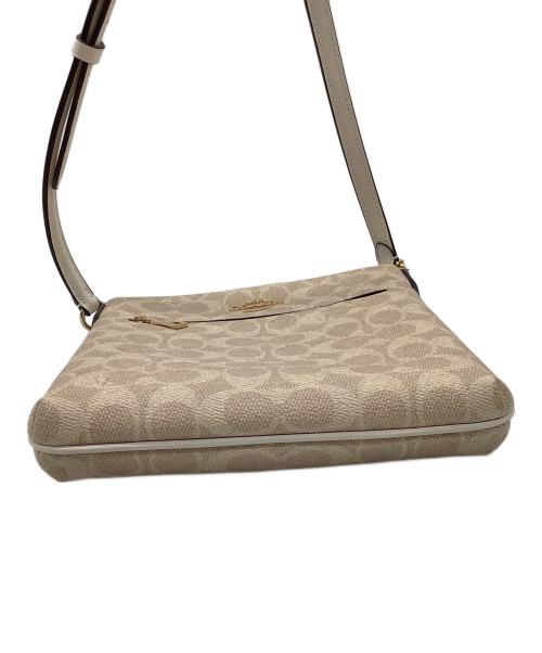 COACH（コーチ）COACH (コーチ) ミニ ローアン ファイル バッグ・シグネチャー キャンバス ベージュの古着・服飾アイテム