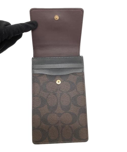 COACH（コーチ）COACH (コーチ) ノース／サウス フォーン クロスボディ・シグネチャー キャンバス ブラウン×ブラック 未使用品の古着・服飾アイテム