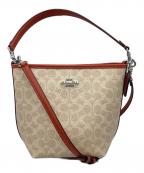 COACHコーチ）の古着「シティ バケット バッグ・シグネチャー キャンバス」｜オレンジ×ベージュ