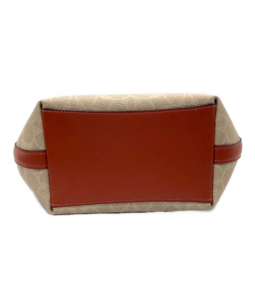 COACH（コーチ）COACH (コーチ) シティ バケット バッグ・シグネチャー キャンバス オレンジ×ベージュ 未使用品の古着・服飾アイテム