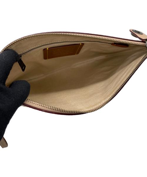 COACH（コーチ）COACH (コーチ) Keith Haring (キースヘリング) クラッチバッグ ピンクの古着・服飾アイテム