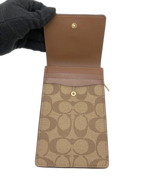 COACH（コーチ）COACH (コーチ) ノース／サウス フォーン クロスボディ・シグネチャー キャンバス 未使用品の古着・服飾アイテム