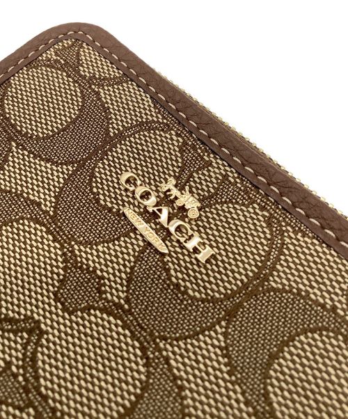 COACH（コーチ）COACH (コーチ) ラウンドファスナー2つ折り財布の古着・服飾アイテム