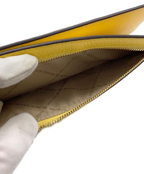 MICHAEL KORS（マイケル・コース）MICHAEL KORS (マイケルコース) ラージスナップ ウォレット イエローの古着・服飾アイテム