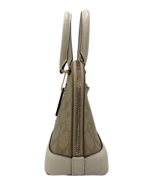 COACH（コーチ）COACH (コーチ) シグネチャー 2WAYバッグ ベージュ×ホワイトの古着・服飾アイテム