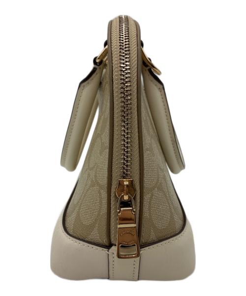 COACH（コーチ）COACH (コーチ) シグネチャー 2WAYバッグ ベージュ×ホワイトの古着・服飾アイテム