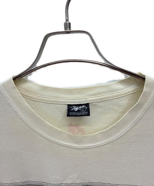 stussy（ステューシー）stussy (ステューシー) RASTA TOM TOM 半袖Tシャツ ホワイト×ブラック サイズ:Lの古着・服飾アイテム