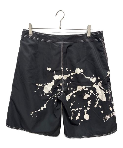 stussy（ステューシー）stussy (ステューシー) ペイントサーフパンツ ブラック×ホワイト サイズ:36の古着・服飾アイテム