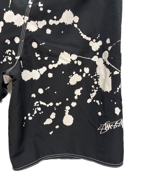 stussy（ステューシー）stussy (ステューシー) ペイントサーフパンツ ブラック×ホワイト サイズ:36の古着・服飾アイテム