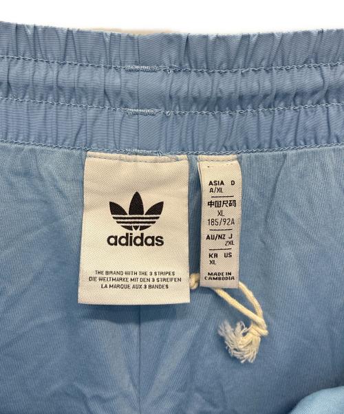 adidas Originals（アディダスオリジナル）adidas originals (アディダスオリジナル) アディカラー ウーブン ファイヤーバードトラックパンツ ブルー サイズ:2XLの古着・服飾アイテム