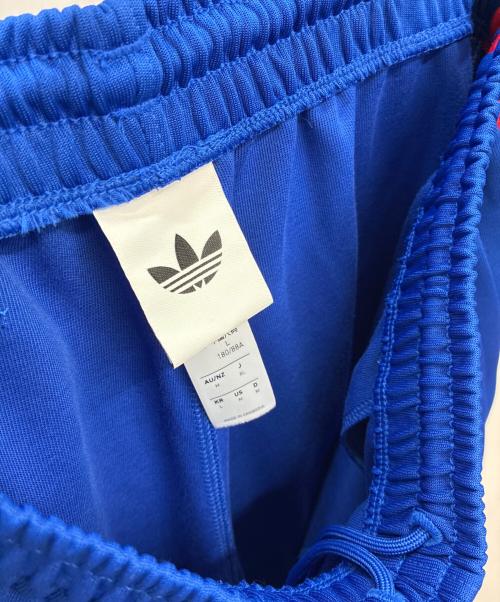 adidas Originals（アディダスオリジナル）adidas originals (アディダスオリジナル) マンチェスター・ユナイテッド オリジナルス トラックパンツ ブルー×レッド サイズ:XLの古着・服飾アイテム