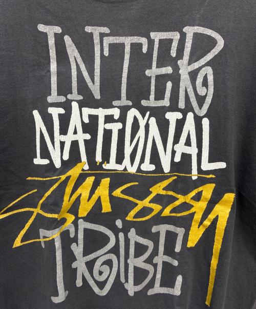 stussy（ステューシー）stussy (ステューシー) 00s INTERNATIONAL TRIBE 半袖Tシャツ ブラック サイズ:XLの古着・服飾アイテム