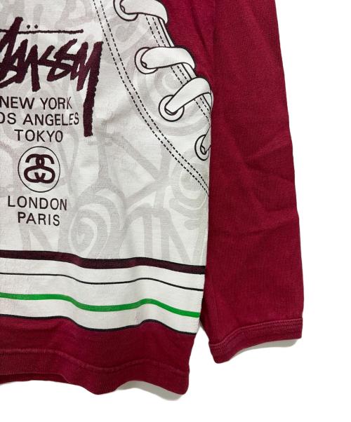 stussy（ステューシー）stussy (ステューシー) 00s スニーカープリント 長袖カットソー レッド サイズ:SIZE Lの古着・服飾アイテム