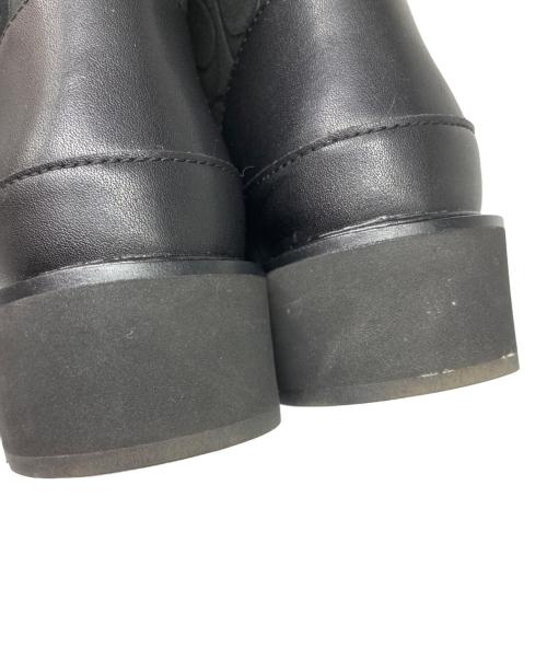 COACH（コーチ）COACH (コーチ) INDI SUEDE BOOTIE シグネチャー ムートンショートブーツ ブラック サイズ:EUR 35.5の古着・服飾アイテム