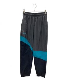 UNDER ARMOUR（アンダーアーマー）の古着「トレーニングパンツ」｜ブラック×グリーン