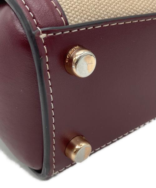 COACH（コーチ）COACH (コーチ) ハンドバッグ ベージュ×ボルドーの古着・服飾アイテム