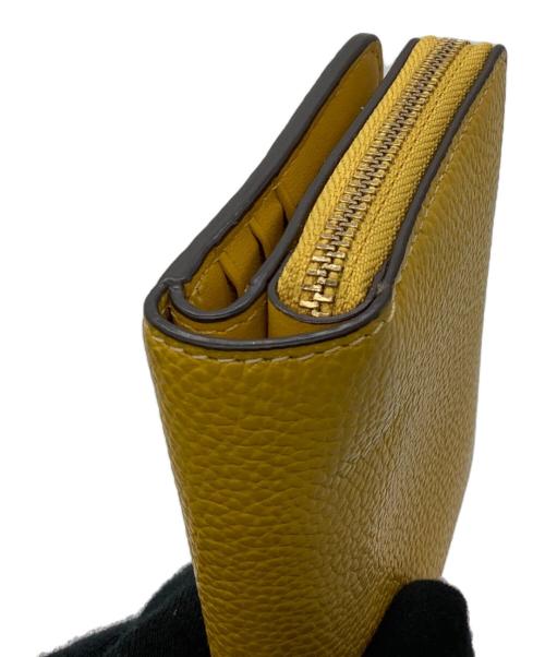 COACH（コーチ）COACH (コーチ) 2つ折り財布 イエローの古着・服飾アイテム